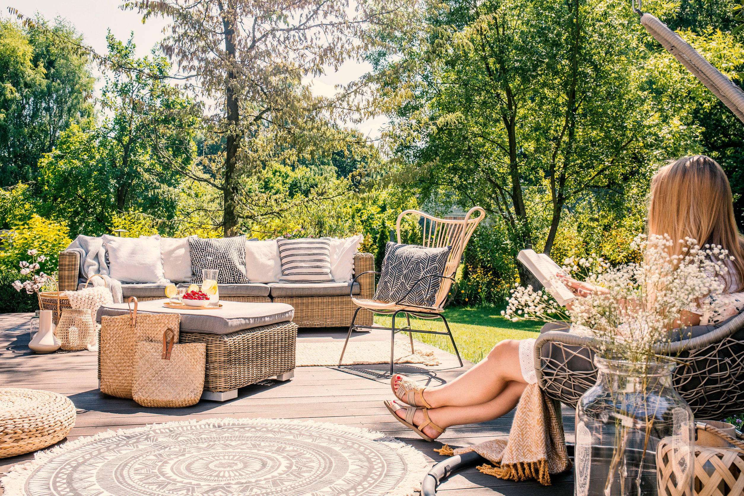 Woman enjoying her patio in the spring.