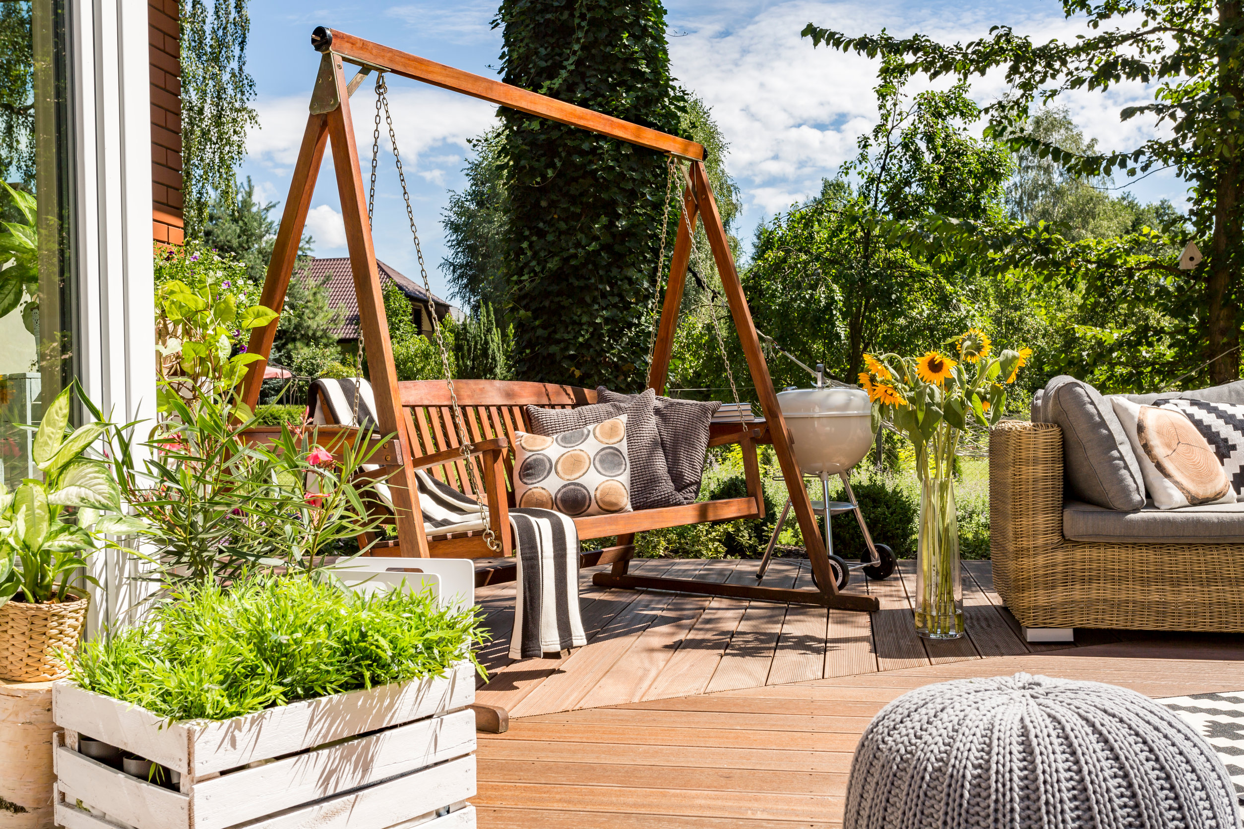 Patio furniture and patio swing in the spring.